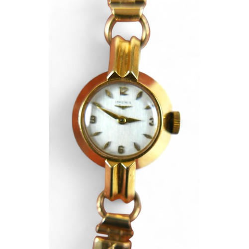 104 - An 18ct yellow gold ladies Longines watch, manual wind, 18mm case on a gold plated sprung strap, tot... 