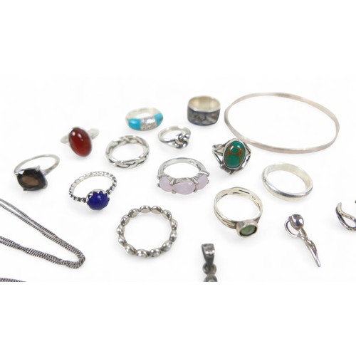 56 - A collection of silver jewellery, comprising rings, necklaces, pendants and a bangle. (28)