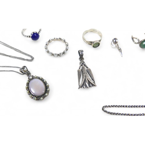 56 - A collection of silver jewellery, comprising rings, necklaces, pendants and a bangle. (28)