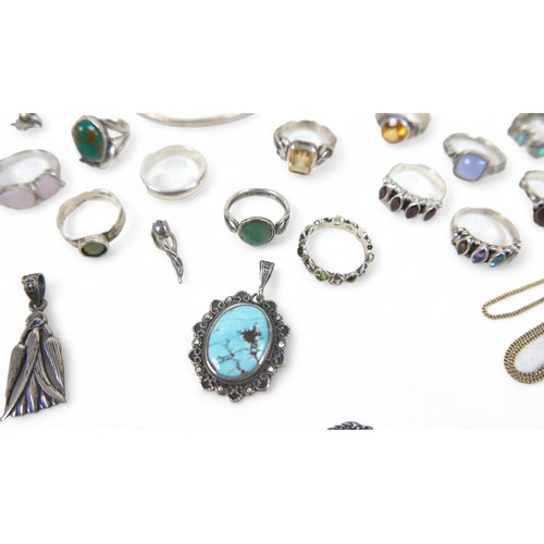 56 - A collection of silver jewellery, comprising rings, necklaces, pendants and a bangle. (28)