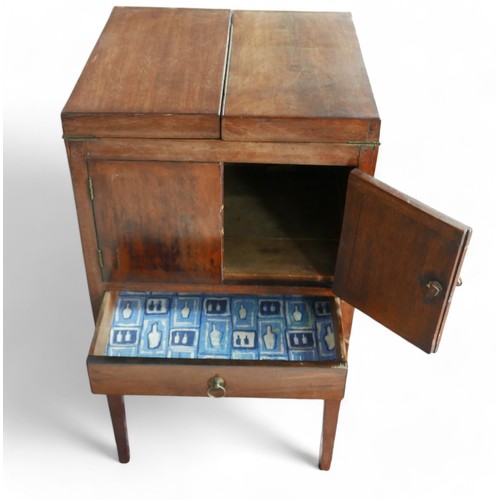 350 - A Georgian mahogany washstand, with fold over top and rising mirror standing on square tapering legs... 