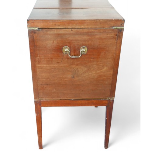 350 - A Georgian mahogany washstand, with fold over top and rising mirror standing on square tapering legs... 