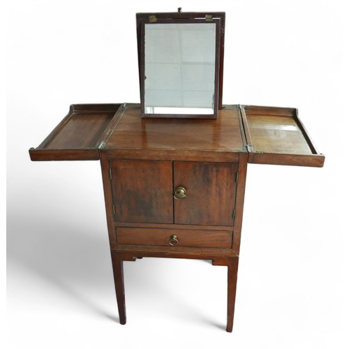 350 - A Georgian mahogany washstand, with fold over top and rising mirror standing on square tapering legs... 