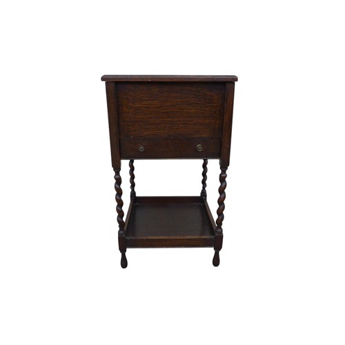 347 - An oak sewing box on barley twist legs, 36.5 by 36.5 by 63cm high.