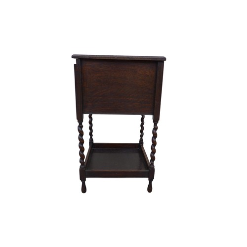 347 - An oak sewing box on barley twist legs, 36.5 by 36.5 by 63cm high.