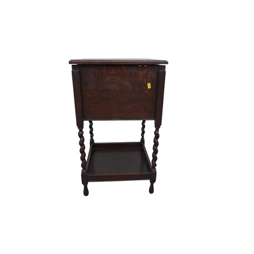 347 - An oak sewing box on barley twist legs, 36.5 by 36.5 by 63cm high.