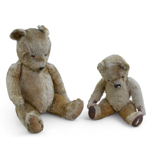 235 - Two vintage teddy bears, comprising a larger bear, missing label, 68cm high, together with a smaller... 