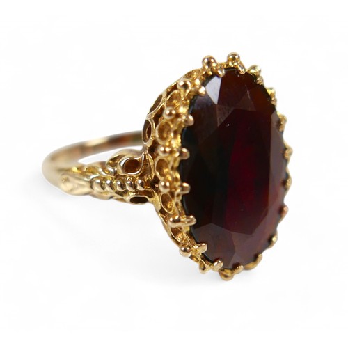 66 - Two 9ct gold rings, comprising a gold and garnet ladies dress ring, the garnet approximately 18 by 1... 