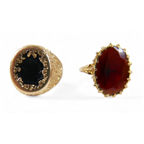 66 - Two 9ct gold rings, comprising a gold and garnet ladies dress ring, the garnet approximately 18 by 1... 