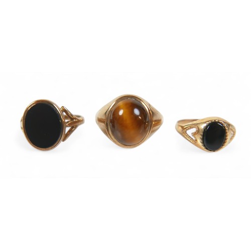 67 - A group of three gold signet rings, comprising a 9ct gold and Tiger's Eye ring, size P/Q, and two 9c... 