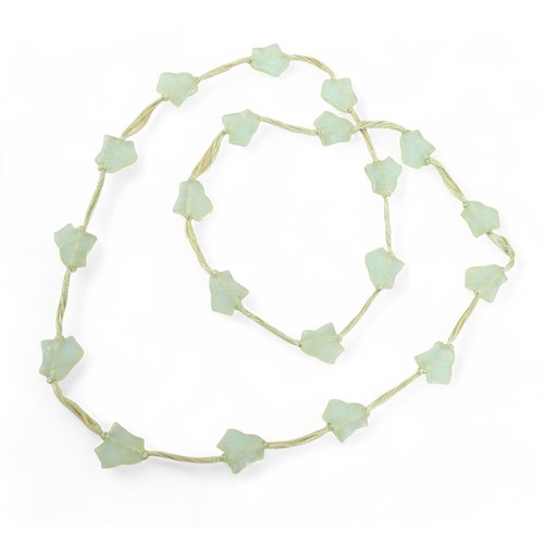 77 - A Lalique 'Feuilles de Lierre' necklace, with twenty glass beads on silk thread, necklace 58cm long.