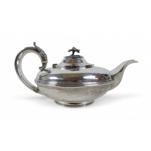 8 - A George III silver teapot, of compressed circular form, with acanthus decoration to handle, with iv... 