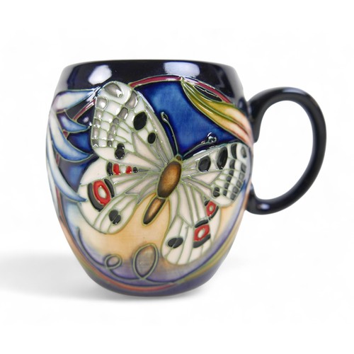 155 - A group of five pieces of Moorcroft pottery, comprising an Apollo Butterfly mug, 9.5cm high, a Hibis... 