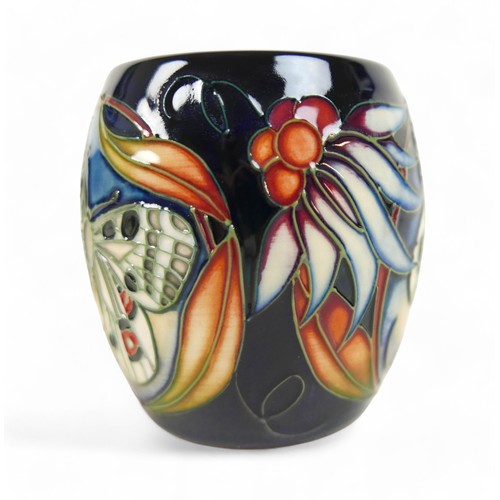 155 - A group of five pieces of Moorcroft pottery, comprising an Apollo Butterfly mug, 9.5cm high, a Hibis... 