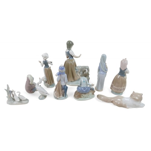 157 - A large collection of Lladro/Nao figurines, including Girl Feeding Goose, 24cm high, Boy with Dog, 5... 