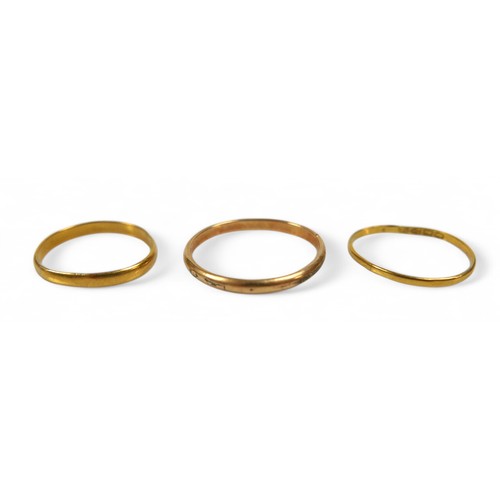 40 - Two gold band rings and a plated band ring, gold rings surface test to approximately 22ct, gold weig... 