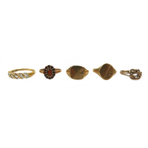 65 - Five gold rings, comprising four 9ct rings 8.7g and an 18ct dress ring size R 3.3g. (5)