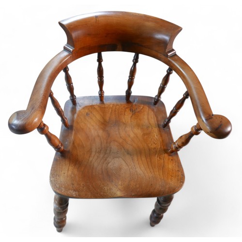 370 - A Victorian ash and yew wood smokers bow armchair, 66 by 54 by 78cm high.