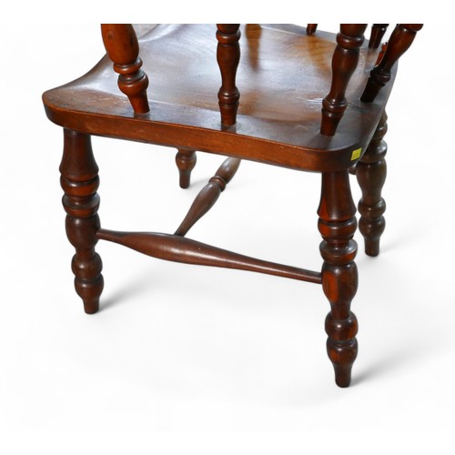 370 - A Victorian ash and yew wood smokers bow armchair, 66 by 54 by 78cm high.