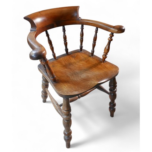 370 - A Victorian ash and yew wood smokers bow armchair, 66 by 54 by 78cm high.