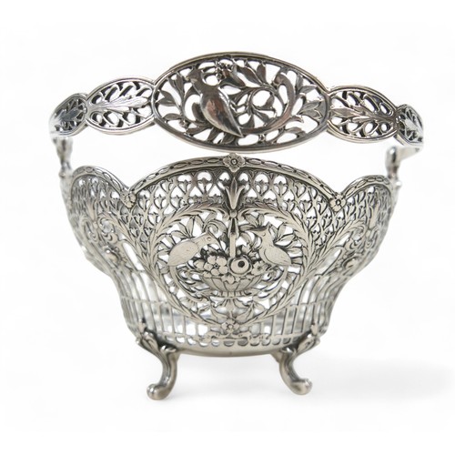 11 - A German/Prussian silver fretwork basket, with bird and flower decoration, marked 800, maker Storck ... 