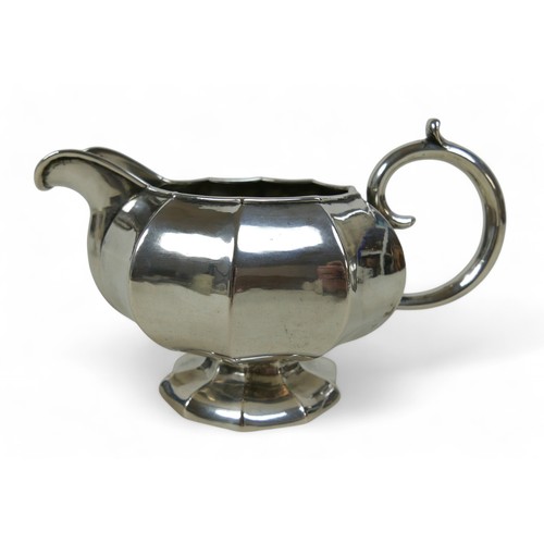 9 - A Russian silver milk jug, sugar basket and plated teapot, the milk jug marked 84 St Petersburg 1859... 