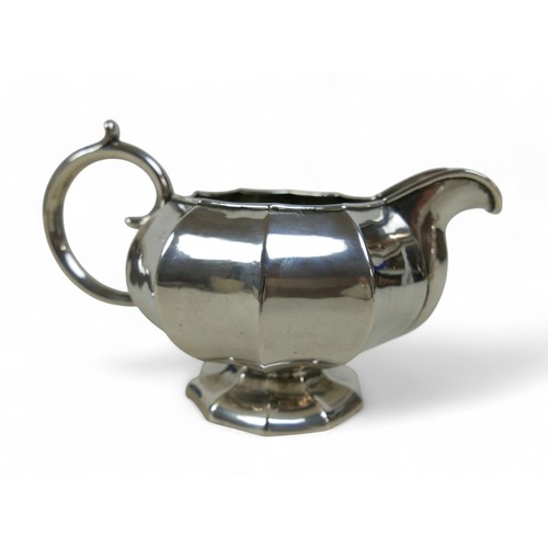 9 - A Russian silver milk jug, sugar basket and plated teapot, the milk jug marked 84 St Petersburg 1859... 