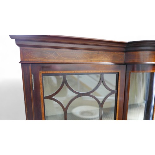 369 - An Edwardian inlaid mahogany display cabinet, with a central bow glass panel flanked either side wit... 