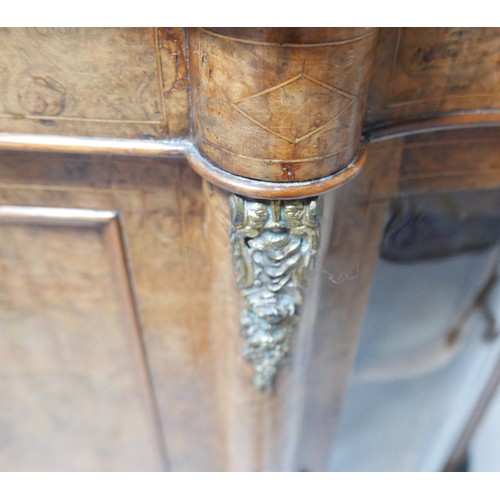 374 - A Victorian inlaid burr walnut credenza/side cabinet, with a shaped top, central door flanked by ser... 