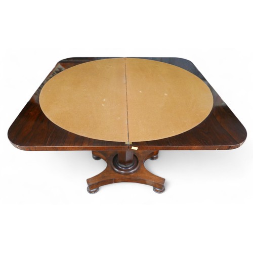 359 - A 19th century rosewood folder top card table, on a tapering octagonal column and platform base with... 