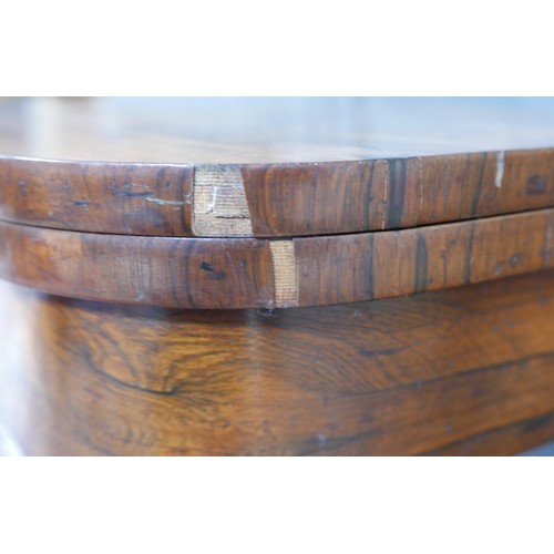 359 - A 19th century rosewood folder top card table, on a tapering octagonal column and platform base with... 