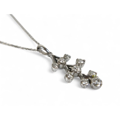 73 - An 18ct white gold diamond pendant on chain, the pendant set with nine brilliant cut diamonds, penda... 