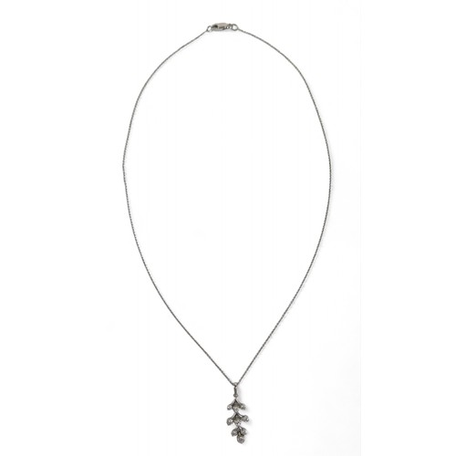 73 - An 18ct white gold diamond pendant on chain, the pendant set with nine brilliant cut diamonds, penda... 