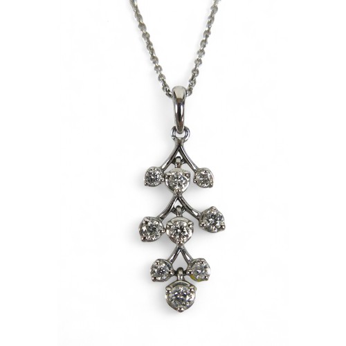 73 - An 18ct white gold diamond pendant on chain, the pendant set with nine brilliant cut diamonds, penda... 