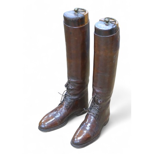 219 - A pair of WWI officer's leather riding boots, both with vintage wooden trees. (2)