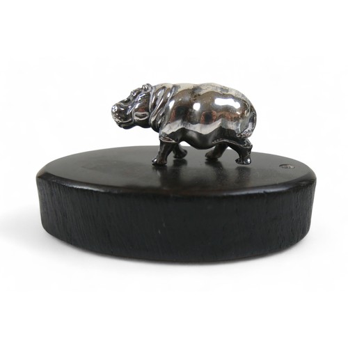 18 - Patrick Mavros: small model of a silver hippo on wooden base, boxed with certificate.