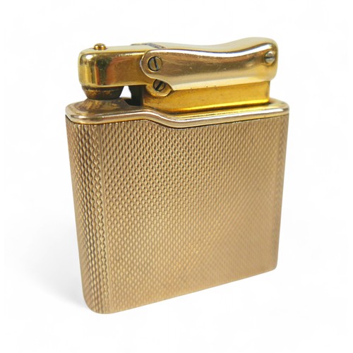 87 - A 9ct gold cased Colibri Monogas lighter, with engine turned decoration, 72.4g gross weight, 9ct gol... 