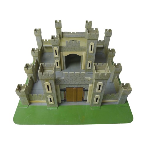 232 - A vintage toy castle, mid 20th century, with shaped and painted wooden pieces slotting together onto... 