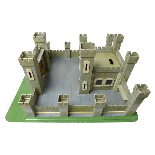 232 - A vintage toy castle, mid 20th century, with shaped and painted wooden pieces slotting together onto... 