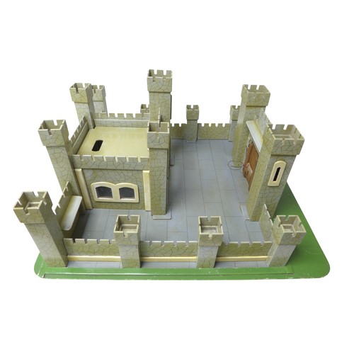 232 - A vintage toy castle, mid 20th century, with shaped and painted wooden pieces slotting together onto... 