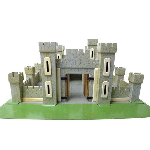 232 - A vintage toy castle, mid 20th century, with shaped and painted wooden pieces slotting together onto... 