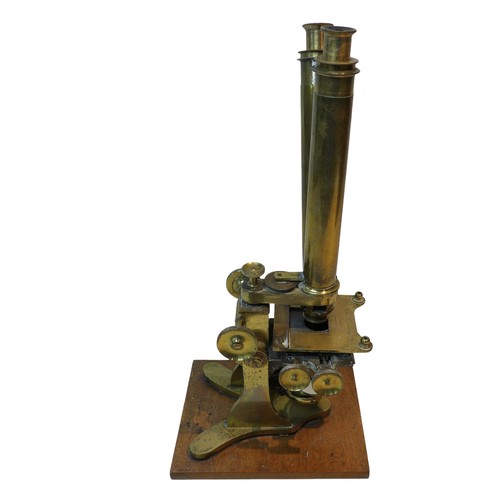 225 - A large Victorian John Browning brass binocular microscope, in wooden box, together with a smaller b... 