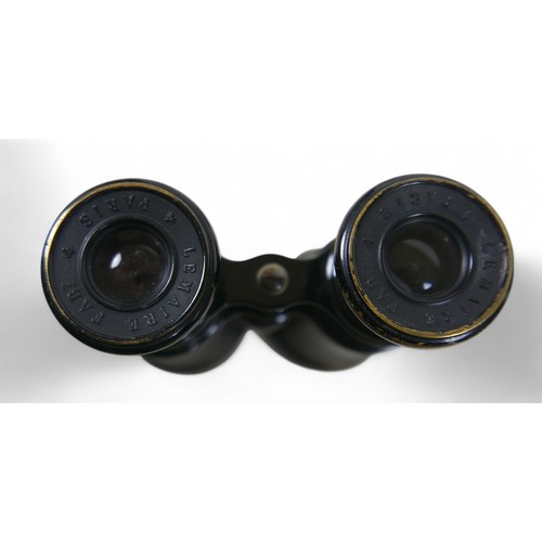 220 - A group of four pairs of binoculars, including a French WWI pair made by Lemaire, Paris, in leather ... 