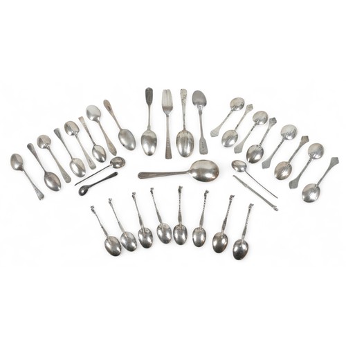 28 - A group of assorted silver flatware, mostly spoons, including a set of eight continental apostle spo... 