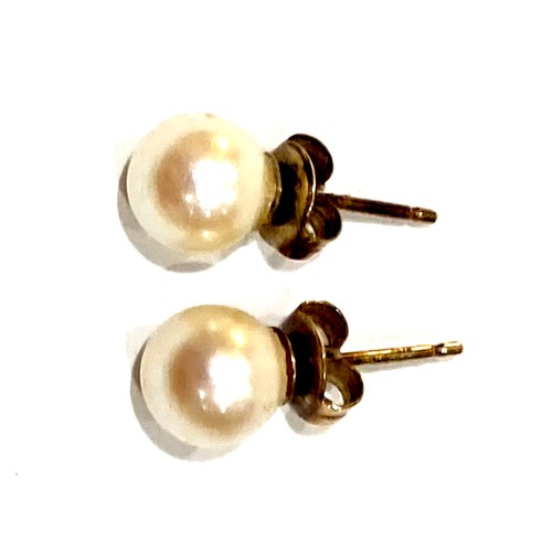 34A - A pair of 9ct gold mounted pearl stud earrings, 7.0mm, on post and scroll fittings, 1.5g, together w... 