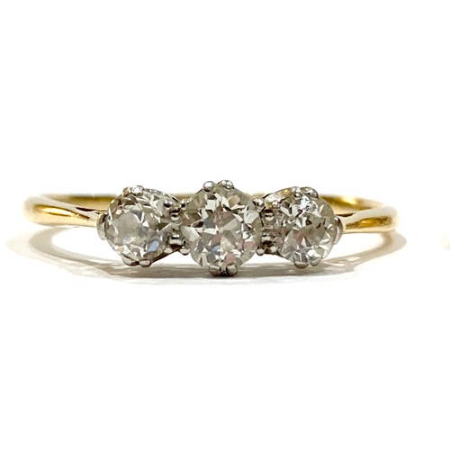 41A - An 18ct yellow gold three stone diamond ring, the central stone 3.5mm, size R, 1.8g, together with a... 