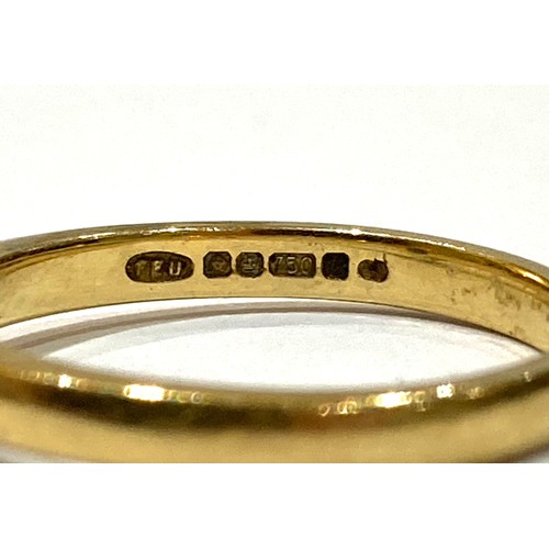 43A - A group of three gold rings, comprising an 18ct yellow gold diamond solitaire ring, the round cut st... 