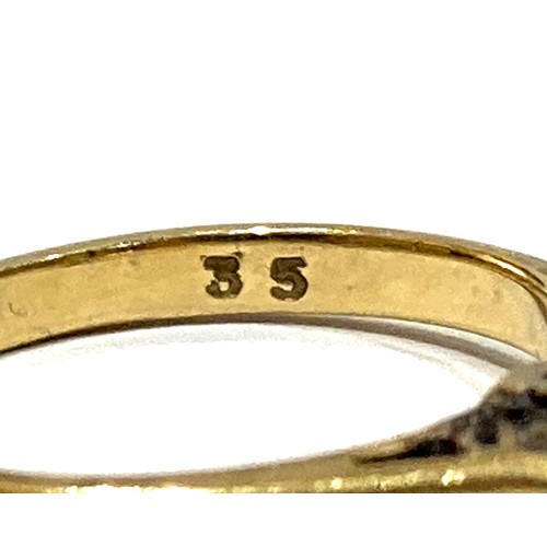 43A - A group of three gold rings, comprising an 18ct yellow gold diamond solitaire ring, the round cut st... 