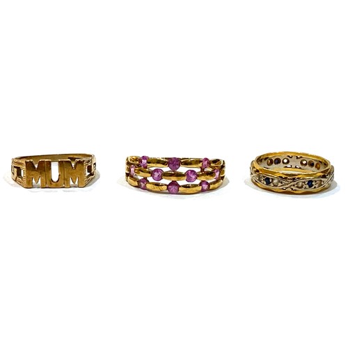 65A - A group of three gold rings, comprising an 18ct white and yellow gold ring set with small dark blue ... 