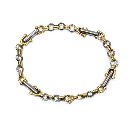 73A - A yellow gold and platinum equestrian theme bracelet, with links in the shape of stirrups, spurs, an... 